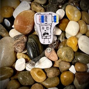 Hand-Drawn Cartoon Badge Reel with White Background and Blue Accent